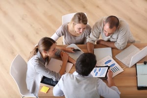 Upper view of business people around table