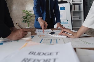 business-team-using-a-calculator-to-calculate-the-2025-01-10-11-05-57-utc